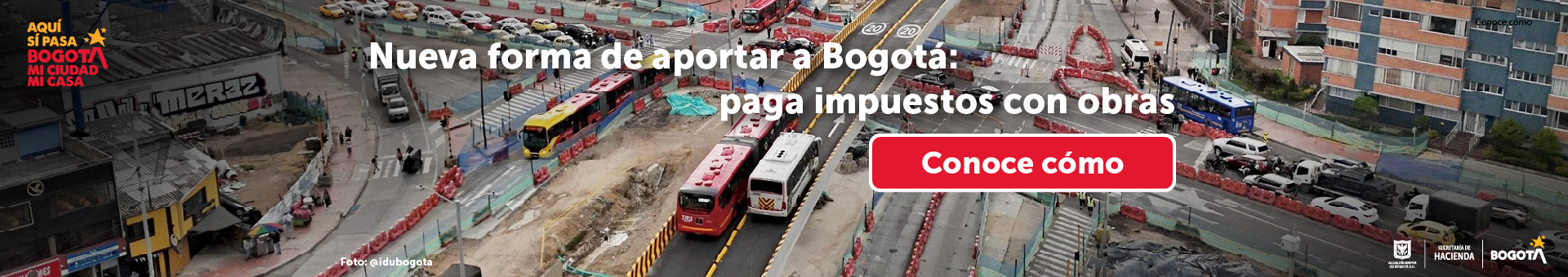 Fotografía de obras del metro en Bogotá con frase alusiva al pago de impuestos
